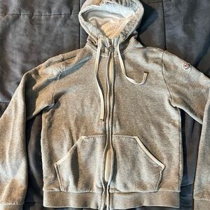 Moncler kids, hooded sweater jacket in size medium in gray used condition